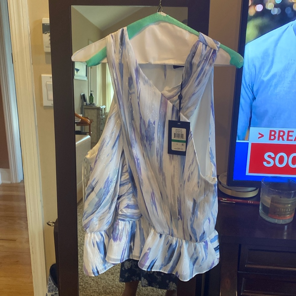 BRAND NEW DKNY halter top blouse w peplum ruffle at the waist. Size L